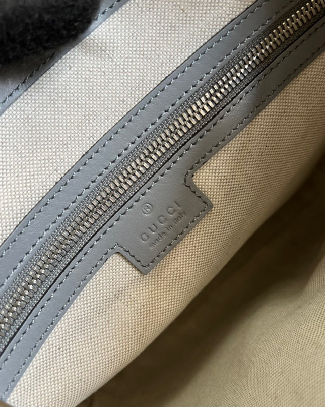 Gucci GG Embossed Leather Messenger Bag – Gray