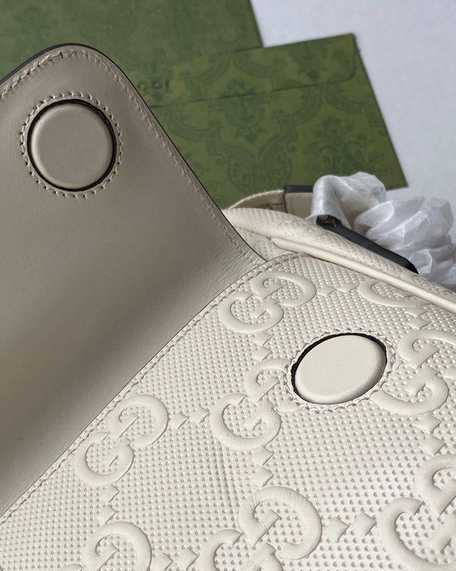 Gucci GG Embossed Leather Messenger Bag –  Beige