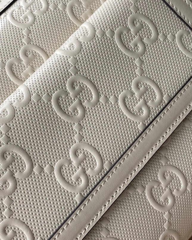 Gucci GG Embossed Leather Messenger Bag –  Beige