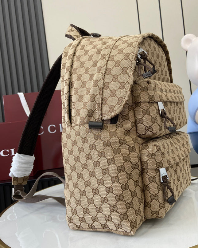 Beige patterned backpack on a white surface with a blurred background